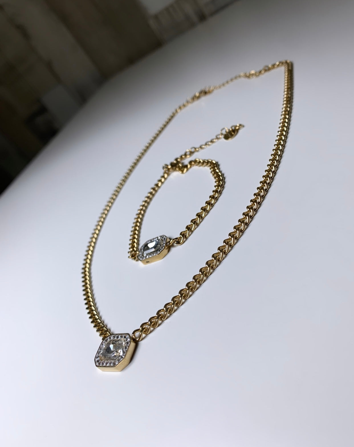 Ensemble collier et gourmette pierre blanche