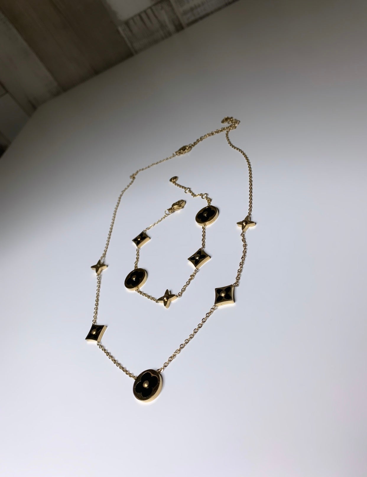 Ensemble collier et gourmette noir et doré